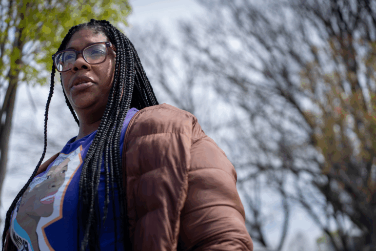 Tracey Malone, executive director of the Sandtown-Winchester Community Collective, stands outside a shuttered recreation center in Baltimore.