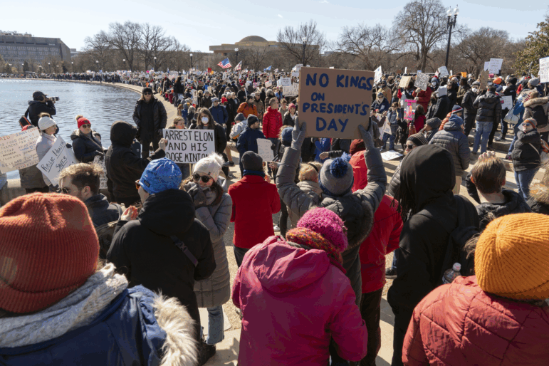 People take part in the "No Kings Day" protest on Presidents Day in Washington, D.C., in support of federal workers and against recent actions by President Trump and Elon Musk, on Feb. 17, 2025. The protest was organized by the 50501 Movement.