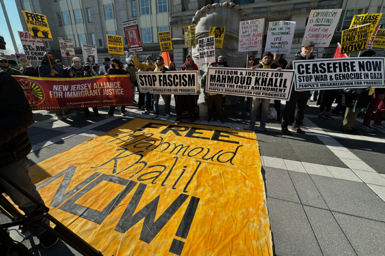 Pro-Palestinian protesters demanding the release of Columbia University graduate student Mahmoud Khalil stand outside his immigration court hearing in Newark, N.J., on Friday, March 28, 2025.