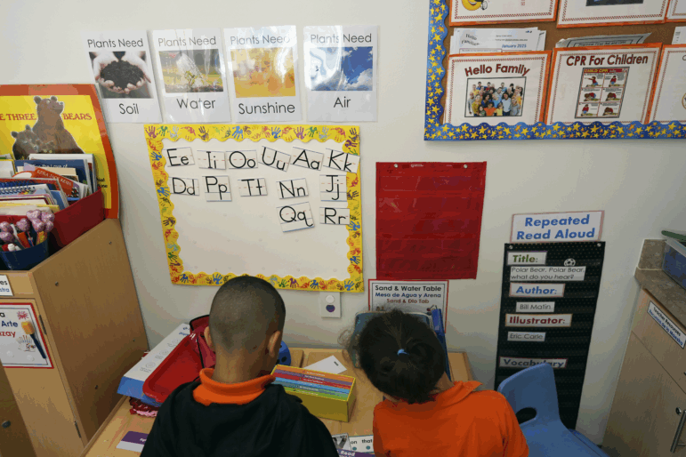 Students help put away supplies at the end of a reading and writing lesson at the Head Start program run by Easterseals, an organization that gets about a third of its funding from the federal government, on Jan. 29 in Miami.