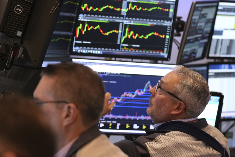 Traders work on the floor Monday at the New York Stock Exchange in New York.
