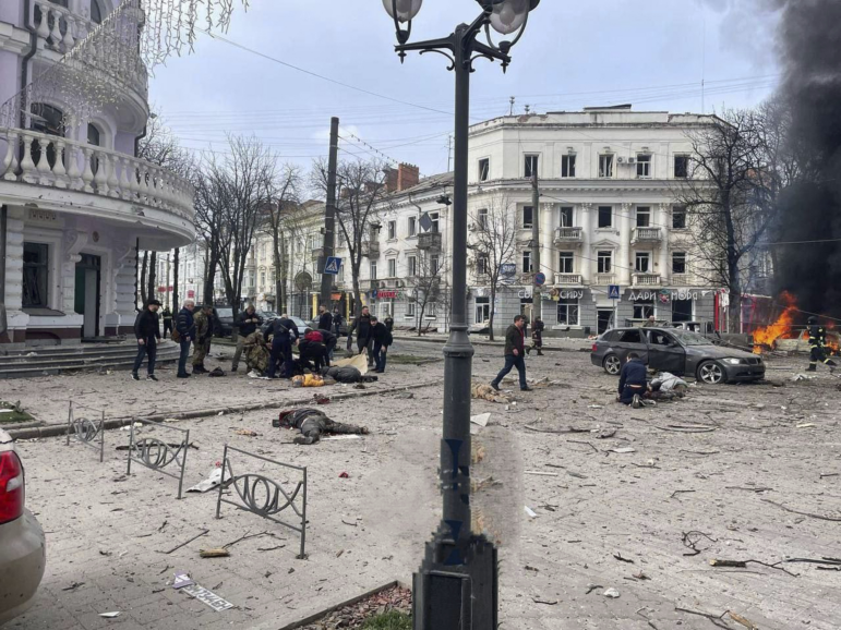 In this photo provided by the Ukrainian Parliament Commissioner for Human Rights Press Service, bodies of the killed residents lie on the ground following a Russia's missile attack that killed at least 20 civilians in Sumy, Ukraine, Sunday, April 13, 2025. (Ukrainian Parliament Commissioner for Human Rights Press Service via AP)