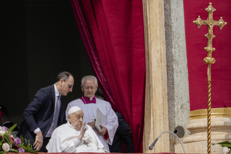 Pope Francis appears on the central lodge of St. Peter's Basilica to bestow the Urbi et Orbi (Latin for to the city and the world) blessing at the end of the Easter mass presided over by Cardinal Angelo Comastri in St. Peter's Square at the Vatican Sunday, April 20, 2025.