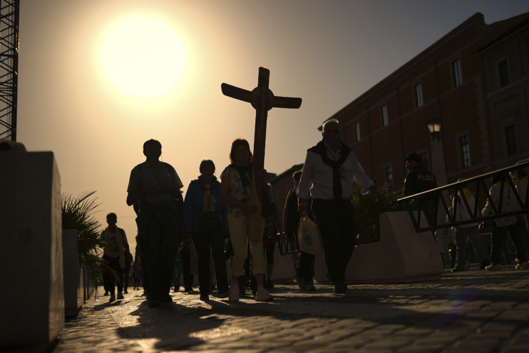 Pilgrims arrive in St. Peter's Square at the Vatican, Tuesday, April 22, 2025.