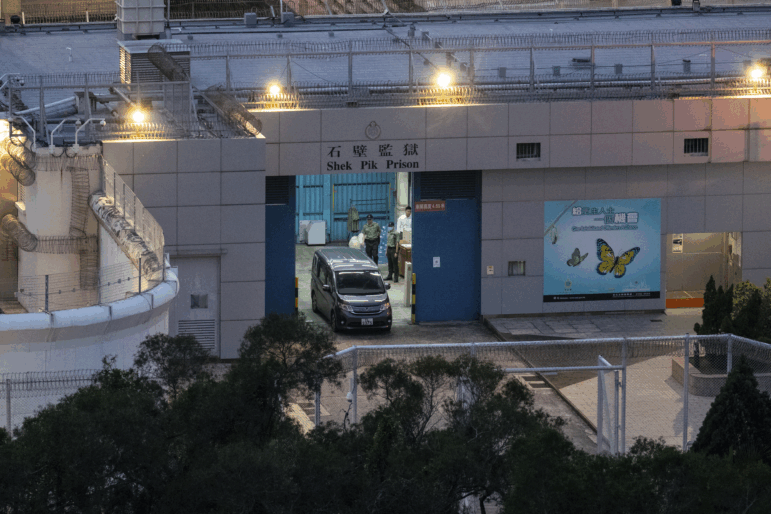 Vehicles believed to be carrying former pro-democracy lawmaker Gary Fan, who was released after four years for his conviction under the national security law, leaves the Shek Pik Prison in Hong Kong on Tuesday.