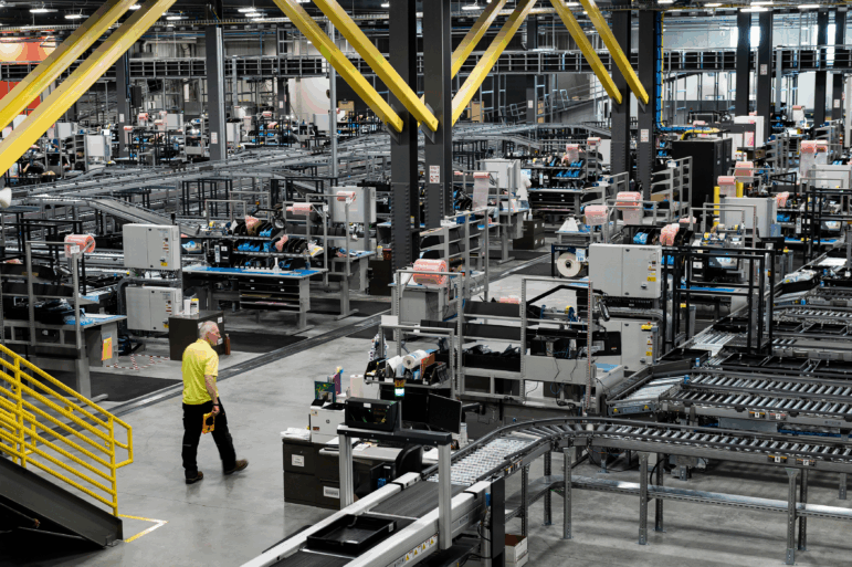 This photo shows the inside of DigiKey's warehouse, which is a cavernous facility filled with conveyor lines.