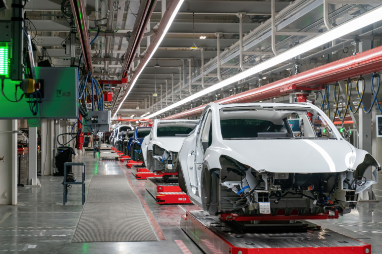 Cars on the Tesla assembly line at the Gigafactory Texas facility on April 7, 2022 in Austin, Texas. Teslas sold in the U.S. are all built in the U.S. But presidential advisor Peter Navarro insinuated this week that they weren't as "made in America" as they seem — a claim Elon Musk has pushed back on.