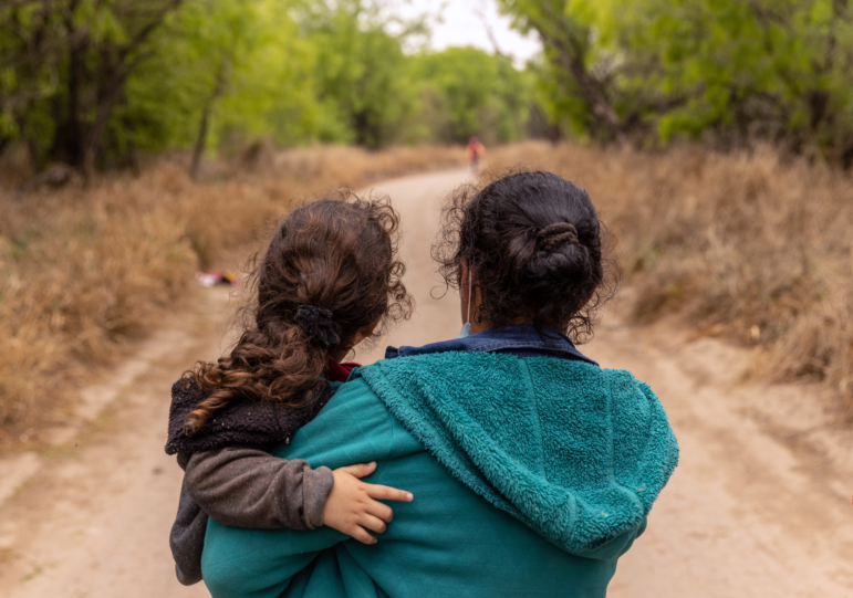 Asylum seekers from Honduras walk towards a U.S. Border Patrol checkpoint after crossing the Rio Grande from Mexico in 2021 near Mission, Texas.