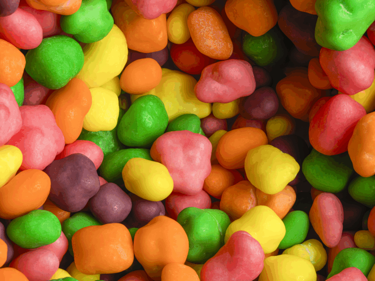 Extreme close up detail pile of multicolored candies