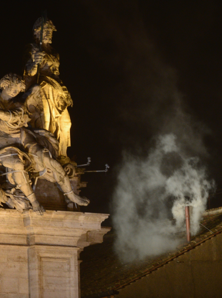 White smoke billows from a chimney at the Sistine Chapel, signaling that cardinal electors have chosen a new pope — Pope Francis — on March 13, 2013. (