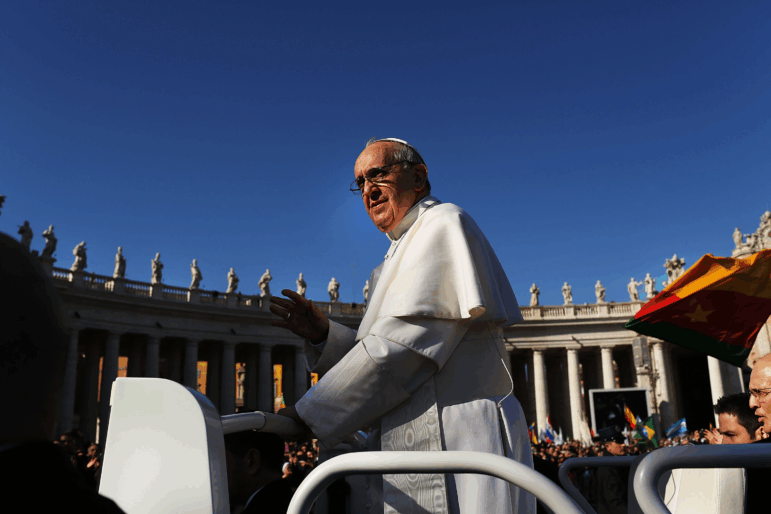 Pope Francis drives through the crowds during the Inauguration Mass for the Pope in St. Peter's Square on March 19, 2013, in Vatican City, Vatican. The mass was held in front of an expected crowd of up to one million pilgrims and faithful who filled the square and the surrounding streets to see the former Cardinal of Buenos Aires officially take up his role as pontiff.
