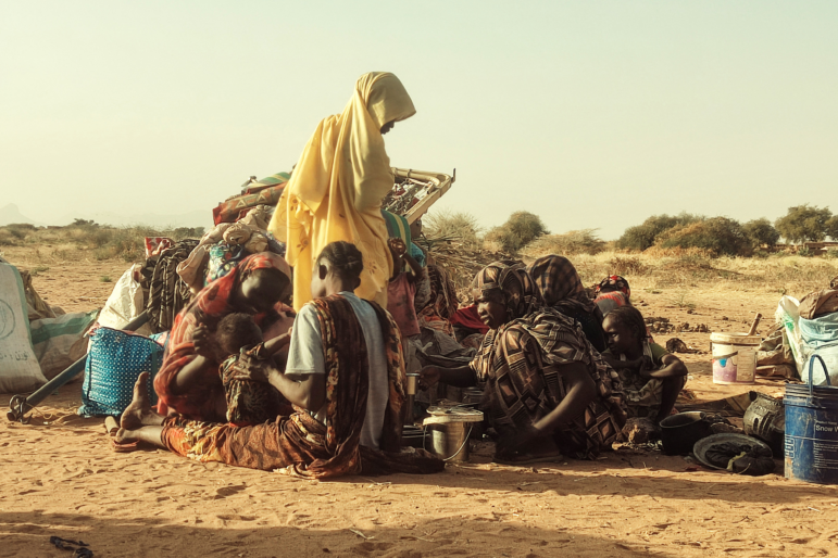 Displaced Sudanese, who fled the Zamzam camp, gather near the town of Tawila in North Darfur