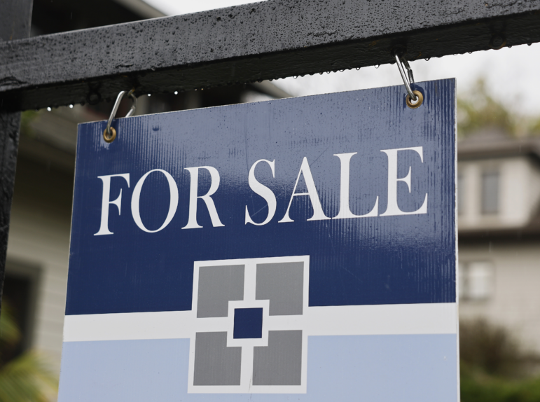 A 'For Sale' sign is posted in front of a home for sale last month in Pasadena, Calif.