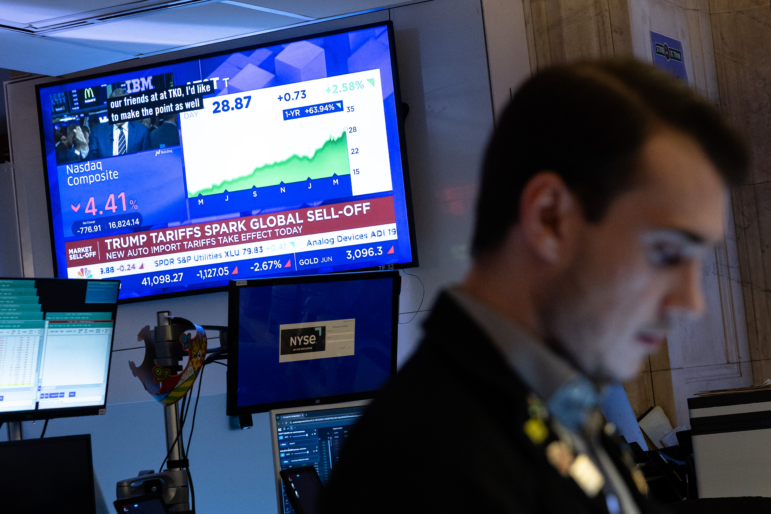 Traders work on the floor of the New York Stock Exchange on Thursday, which saw the worst markets selloff in five years.