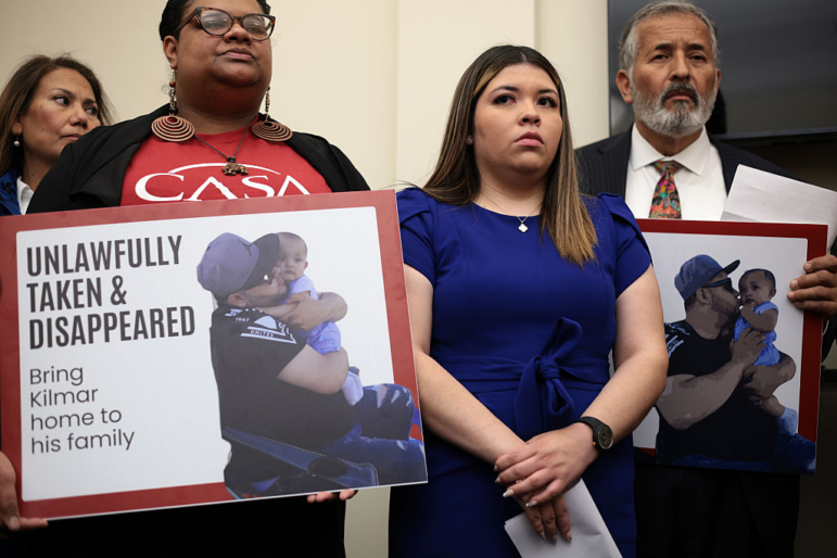The wife of Kilmar Abrego Garcia, Jennifer Vasquez Sura (center), listens during a news conference to discuss his husband’s arrest and deportation on Capitol Hill on April 9.