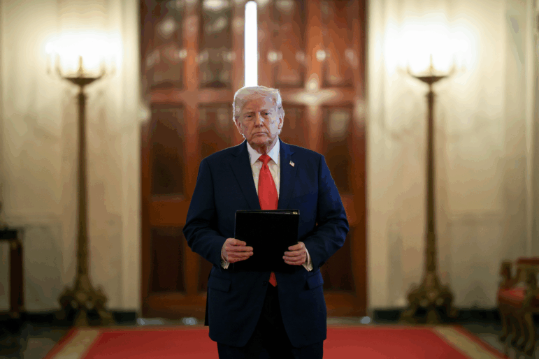 President Trump arrives for a presentation ceremony for the Commander-in-Chief Trophy to the U.S. Naval Academy in the East Room of the White House on Tuesday.