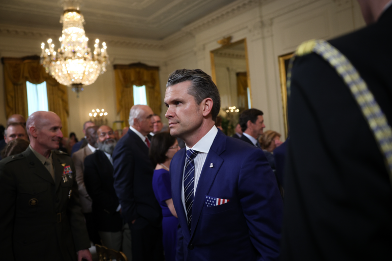 Secretary of Defense Pete Hegseth departs a presentation ceremony for the Commander-in-Chief Trophy to the U.S. Naval Academy Midshipmen football team in the East Room of the White House on April 15.