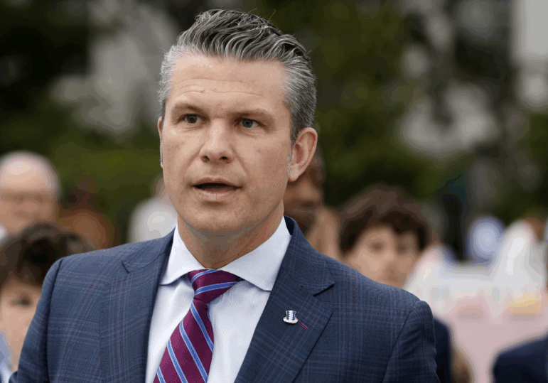Secretary of Defense Pete Hegseth speaks to reporters during the White House Easter Egg Roll on the South Lawn of the White House on April 21, the day after The New York Times reported that he shared information last month to a second private Signal group chat about strikes in Yemen.