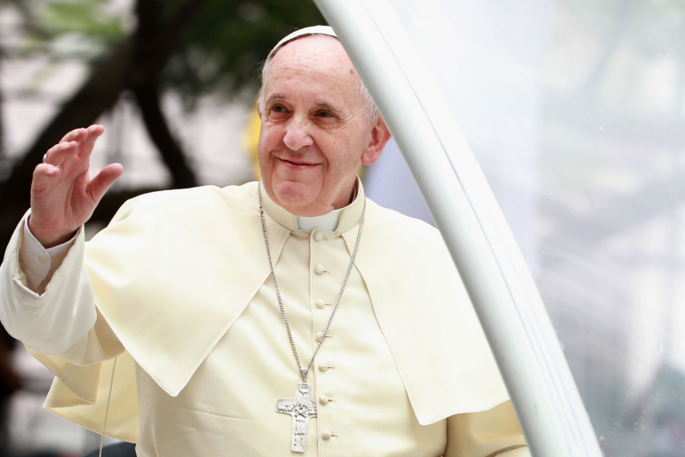 Pope Francis waves to thousands of followers as he arrives at the Manila Cathedral on January 16, 2015 in Manila, Philippines. During his papacy, Francis strove to reach out to what he called the "periphery" of the world in Asia, Africa and Latin America.