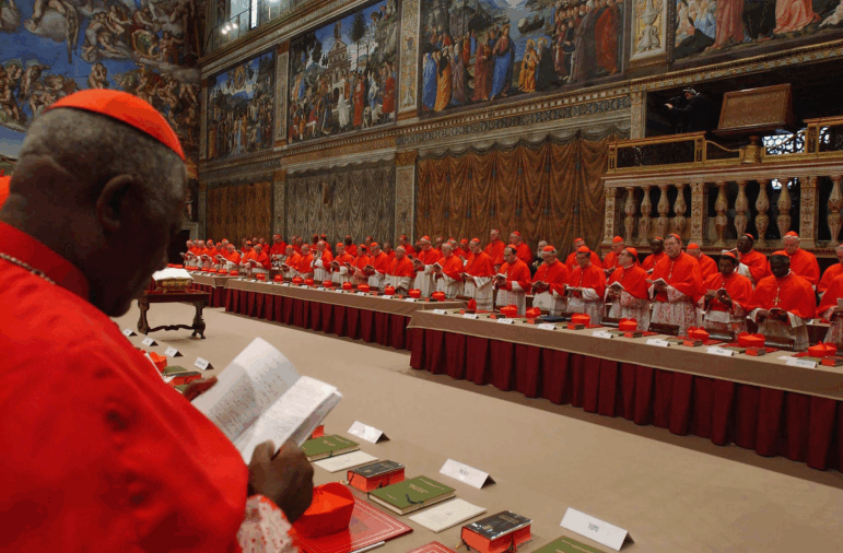 Cardinal electors attend the papal conclave inside the Sistine Chapel on April 18, 2005.