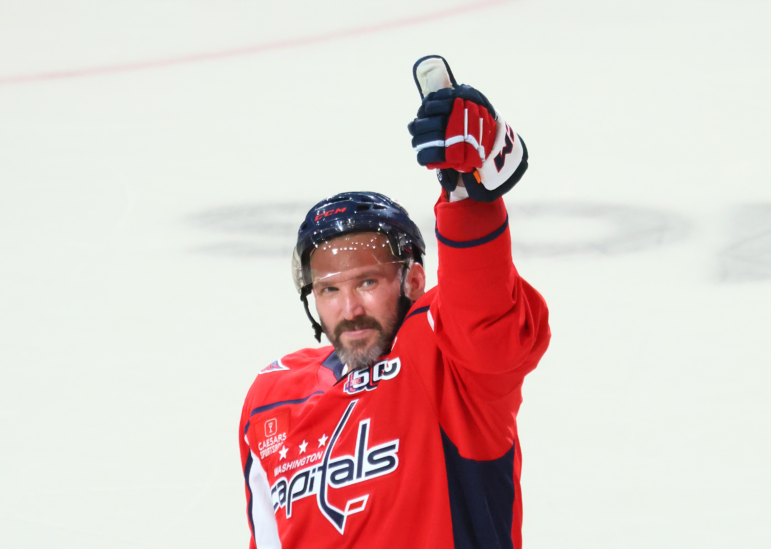 Alex Ovechkin of the Washington Capitals celebrates after defeating the Chicago Blackhawks and scoring his 894th career goal at Capital One Arena on Friday in Washington, DC. Ovechkin's goal ties him with Wayne Gretzky for the all-time goal scoring record.