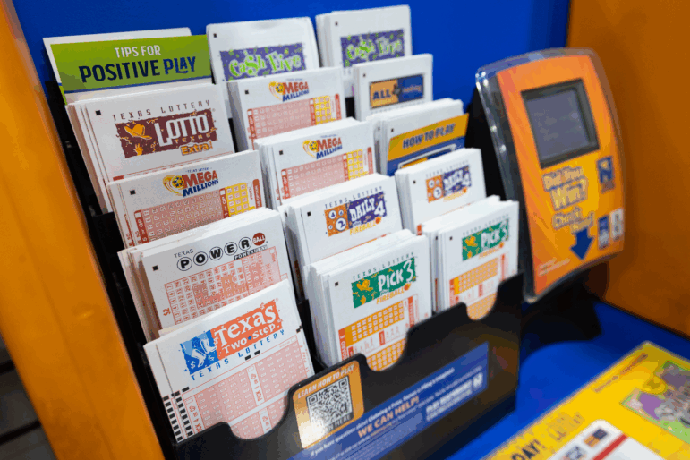 A Texas Lottery display promoting support for Texas education and veterans stands inside Lucky Rudy’s in Rosenberg, Texas, on May 5, 2025.