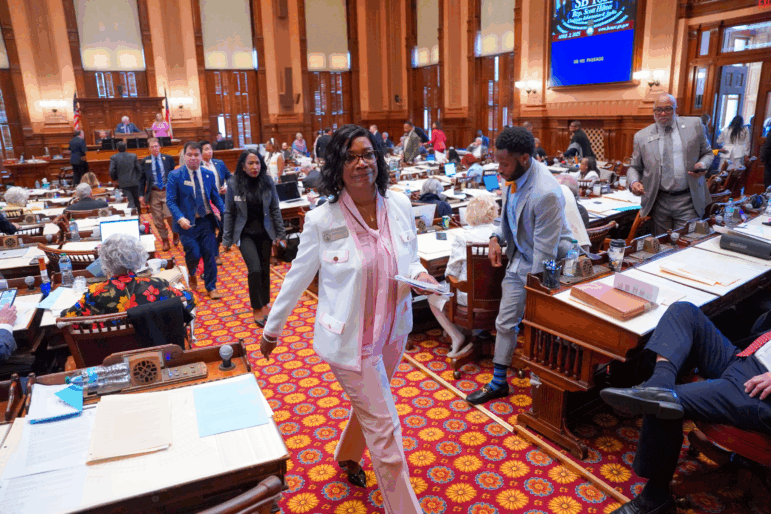 Democratic lawmakers, led by Minority Leader Carolyn Hugley, walk out of the Georgia House of Representatives last month, skipping a vote on a bill to ban gender-affirming care for inmates in state prisons.