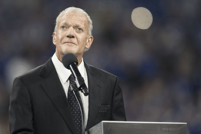 Jim Irsay speaks from a podium in 2018.