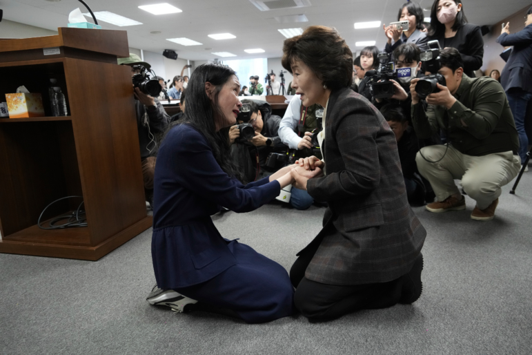 Truth and Reconciliation Commission Chairperson Park Sun Young (right) comforts adoptee Yooree Kim during a press conference in Seoul, South Korea, March 26.