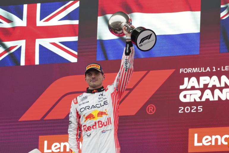F1 driver Max Verstappen of the Netherlands raises his trophy after the Japanese Formula One Grand Prix on April 6, 2025.