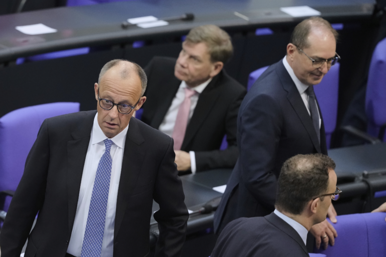 Friedrich Merz, left, reacts after he fell short of votes need to be chancellor in first round vote at the parliament Bundestag in Berlin on Tuesday.