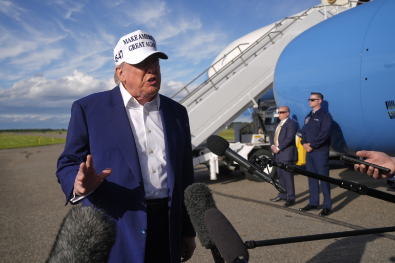 President Trump speaks to reporters before boarding Air Force One at Morristown Municipal Airport in Morristown, N.J., on Sunday.