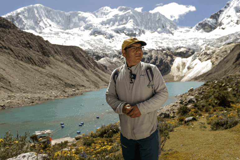 Saul Luciano Lliuya in front of Lake Palcacocha, located at 4,650 meters above sea level at the Huascaran National Park, in Huaraz, northeastern Peru, on May 23, 2022.