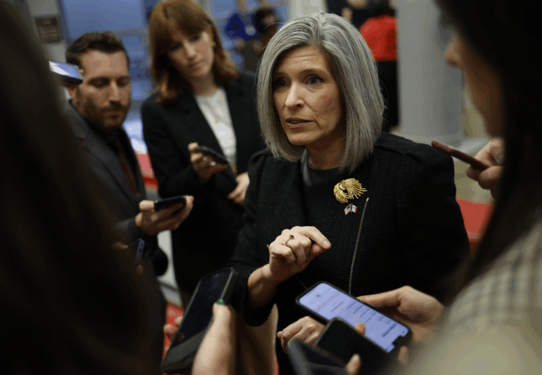 U.S. Sen. Joni Ernst, R-Iowa, speaks to reporters as she walks to a Senate luncheons at the U.S. Capitol on Nov. 19, 2024.