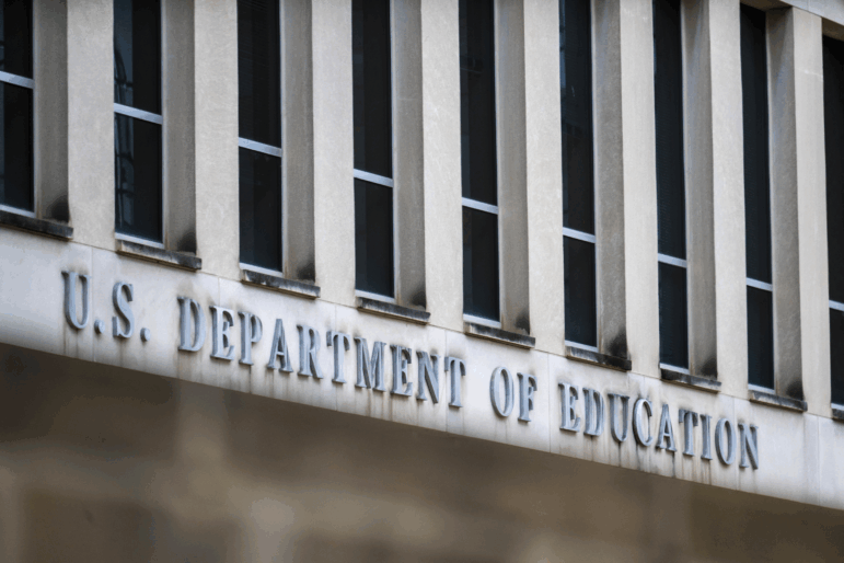 Individual letters on the front of a building spell out "U.S. Department of Education."