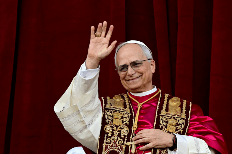 Newly elected Pope Leo XIV, Robert Prevost addresses the crowd from the main central loggia balcony of the St Peter's Basilica for the first time, after the cardinals ended the conclave, in The Vatican, on May 8, 2025.