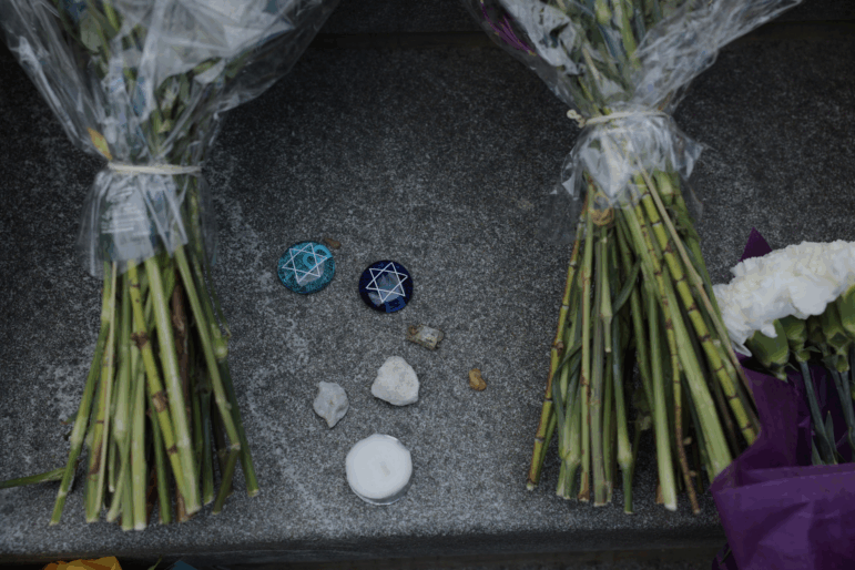 Flowers and stones are left outside the Lillian and Albert Small Capital Jewish Museum on May 23 in Washington, D.C.