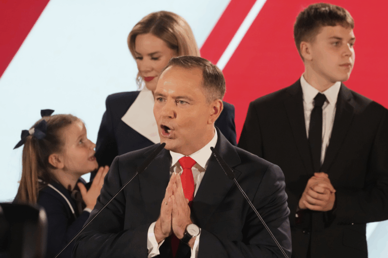 Presidential candidate Karol Nawrocki, a conservative historian backed by the right-wing Law and Justice party addresses supporters at his headquarters after the presidential election runoff in Warsaw, Poland on Sunday.