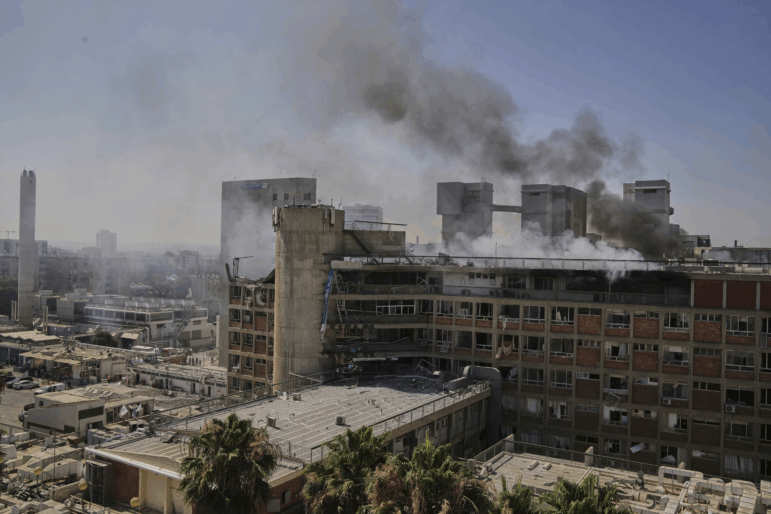 Smokes raises from a building of the Soroka hospital complex after it was hit by a missile fired from Iran in Be'er Sheva, Israel on Thursday.