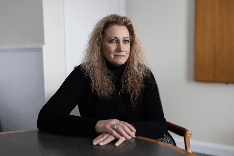 Marlean Ames in her lawyer's office in Akron, Ohio, on Feb. 20. Ames claims she was passed over for jobs because she is a straight woman and that gay people were given positions she was more qualified for.