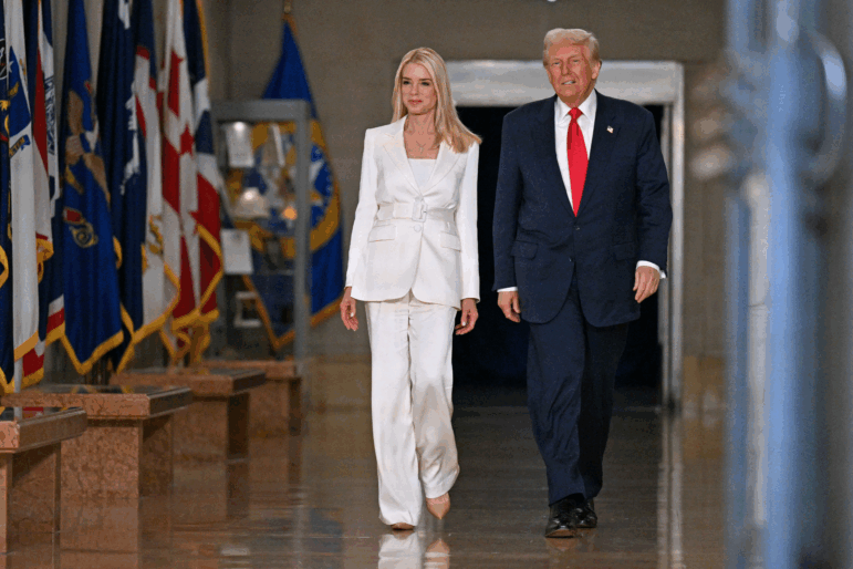 President Donald Trump and Attorney General Pam Bondi arrive to speak at the Department of Justice on March 14, 2025.