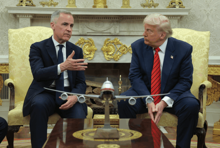 President Trump meets with Canadian Prime Minister Mark Carney in the Oval Office at the White House in Washington, D.C., on May 6, 2025. Carney's government on Sunday said it would scrap a tax on U.S. tech companies after Trump threatened higher tariffs on Canadian goods.