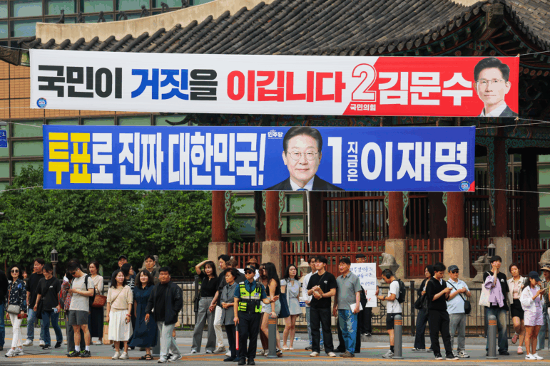 Election campaign banners for presidential candidates Lee Jae-myung of the Democratic Party of Korea and Kim Moon-soo of the People Power Party, as the country's presidential election nears, in Seoul, South Korea, on May 31, 2025. Seven presidential candidates from different parties will compete for the East Asian country's next presidency, following the ousting of impeached former president Yoon Suk-Yeol. Taiwan-China geopolitical tensions, United States tariff, international trade, ageing population as well as economic development are some of the agenda issues being discussed during the election period. (Photo by Daniel Ceng/Anadolu via Getty Images)