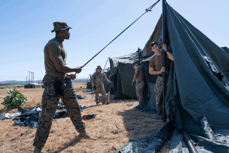 U.S. service members set up tents in at Naval Station Guantanamo Bay in support of the removal operations led by DHS at Naval Station Guantanamo Bay.
