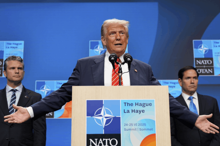 President Donald Trump speaks during a media conference at the end of the NATO summit as Foreign Secretary Marco Rubio, right, and Defence Secretary Pete Hegseth listen, in The Hague, Netherlands, Wednesday, June 25, 2025.