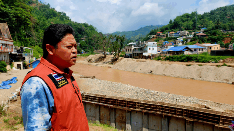 Bundit Pantarakon, a local businessman and city council member in Mae Sai, Thailand, looks over the Sai River.