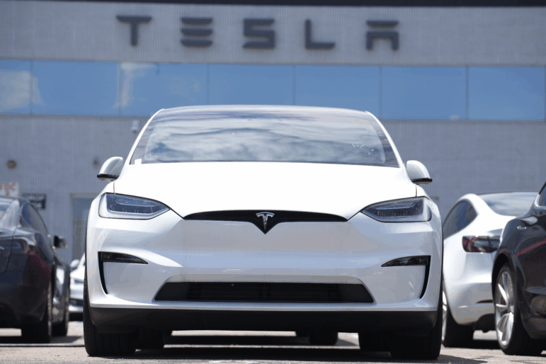 A 2023 Model X sports-utility vehicle sits outside a Tesla dealership Sunday, June 18, 2023, in Englewood, Colo.