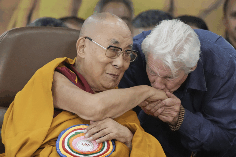 Actor Richard Gere, right, kisses the hand of Tibetan spiritual leader the Dalai Lama at an event celebrating the Dalai Lama's 90th birthday in Dharamshala, India, Sunday.