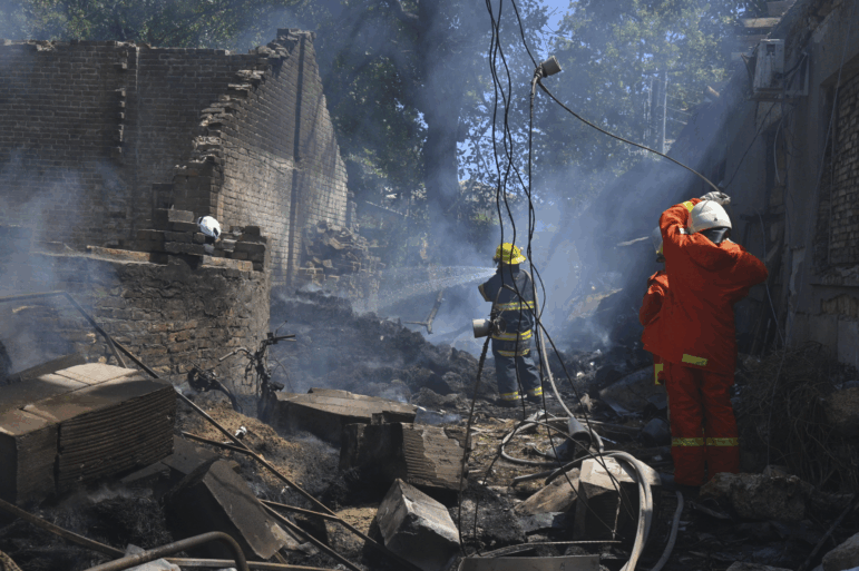 Emergency services personnel work to extinguish a fire following a Russian attack in Odesa, Ukraine on July 11.