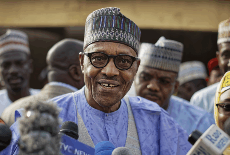 Nigeria's President Muhammadu Buhari speaks to the media after casting his vote in his hometown of Daura, in northern Nigeria, Saturday, Feb. 23, 2019.